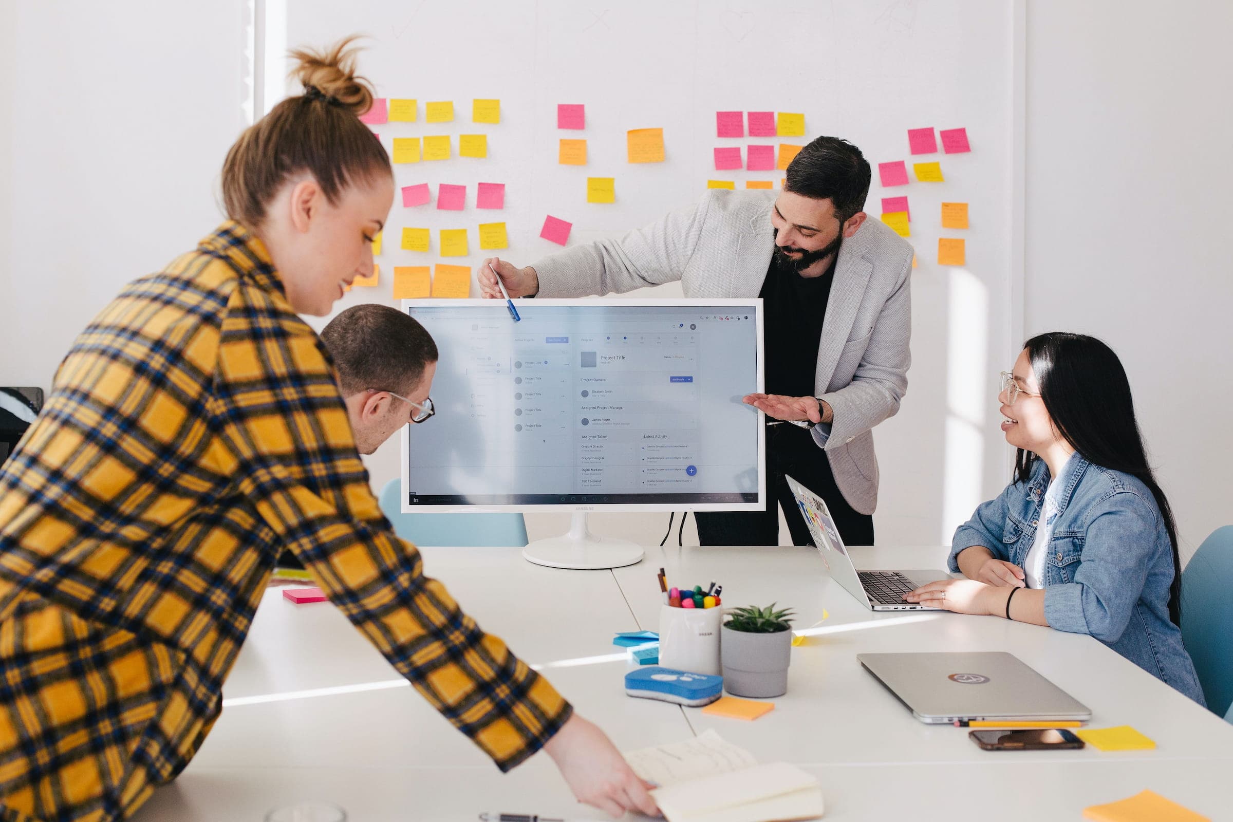 Team members in a project delivery meeting discussing results